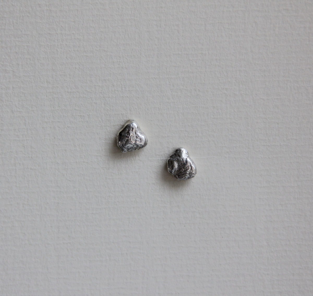 små molten silver studs