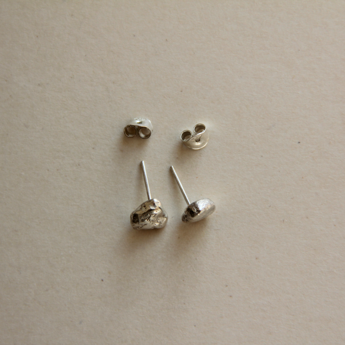små molten silver studs