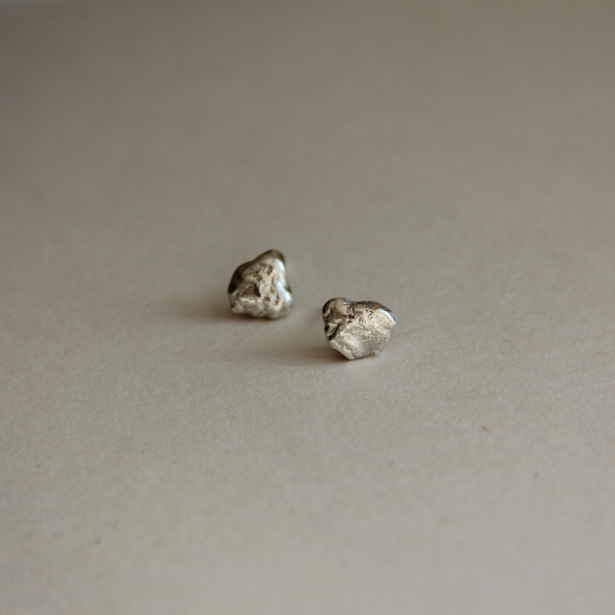 små molten silver studs